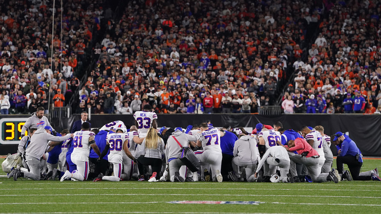 Buffalo Bills players kneeling for Damar Hamlin