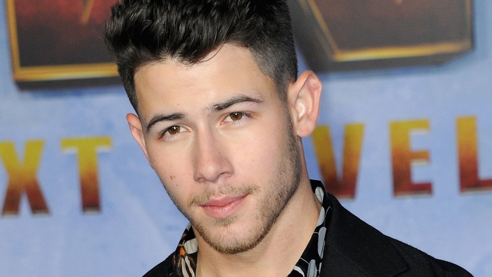 Nick Jonas posing on the red carpet