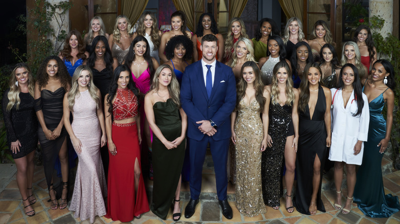 The Bachelor surrounded by female contestants