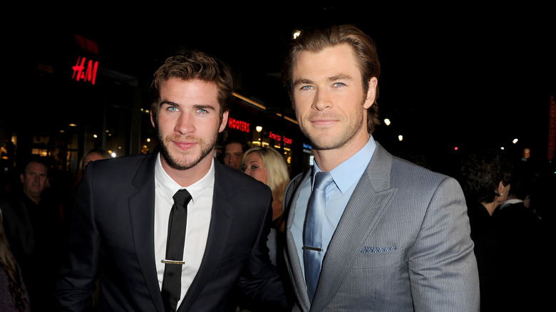 Liam and Chris Hemsworth smiling