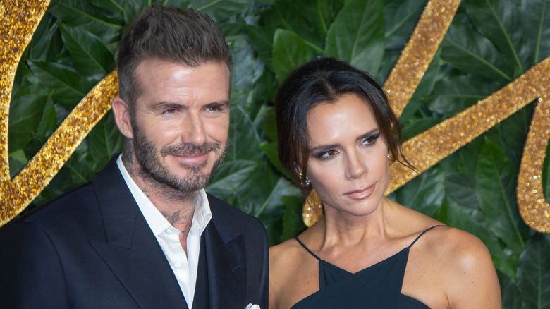 David and Victoria Beckham wearing black