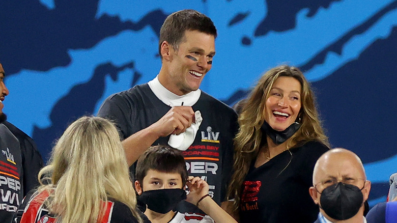 Tom Brady and Gisele Bündchen celebrating on the field