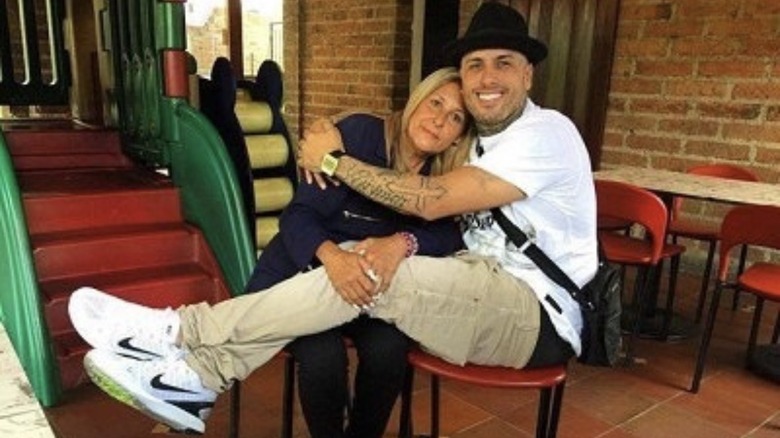 Nicky Jam hugging his mother