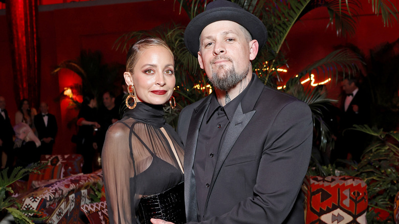 Nicole Richie and Joel Madden posing