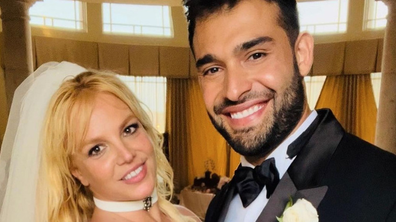 Britney Spears and Sam Asghari smiling at wedding