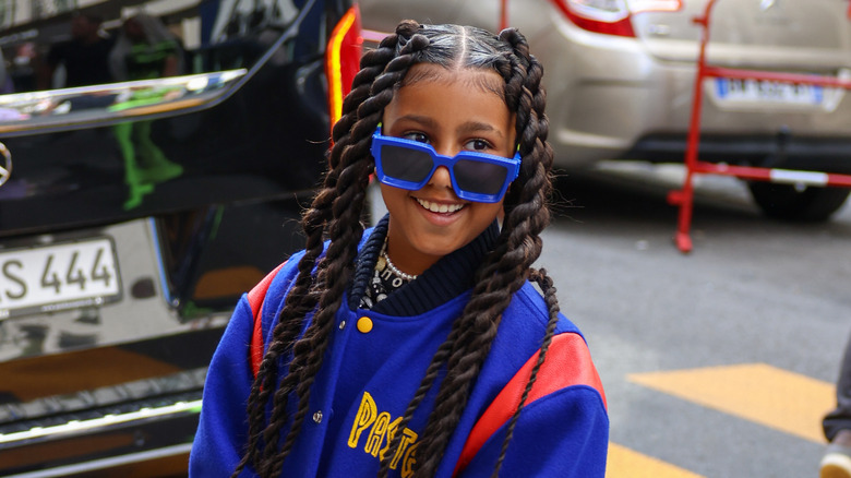 North West smiling on the streets of Paris.