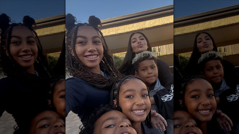 North taking a selfie with her mom and siblings at home