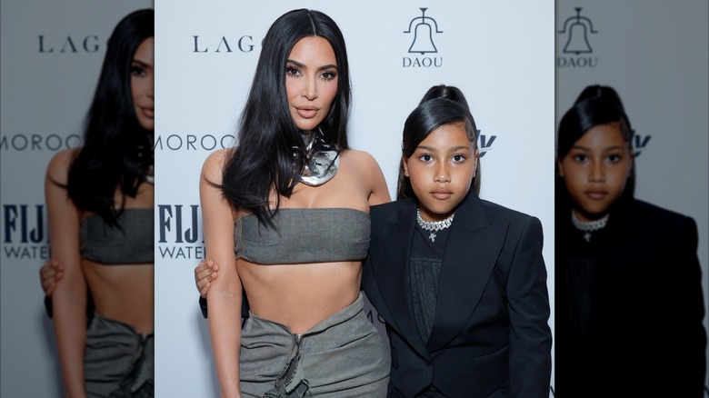 Kim Kardashian and North West on a red carpet.