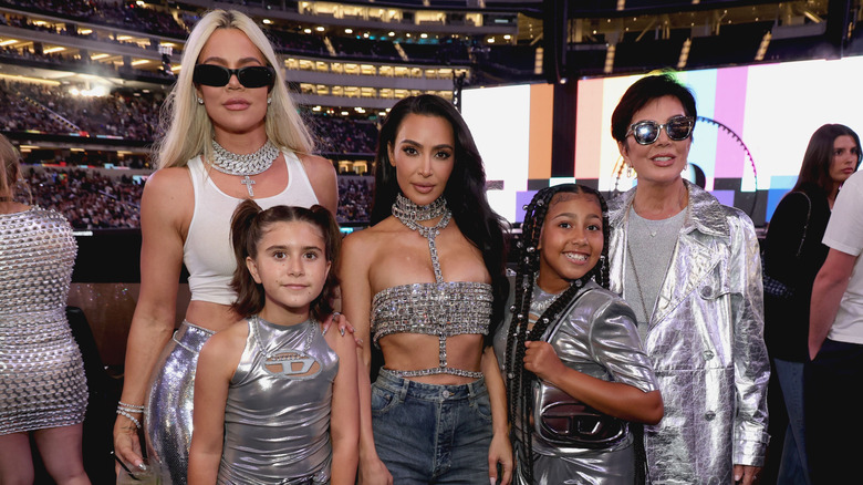 Kourtney, Kim, and Kris Kardashian, North West, and Penelope Disick posing at Beyonce's concert