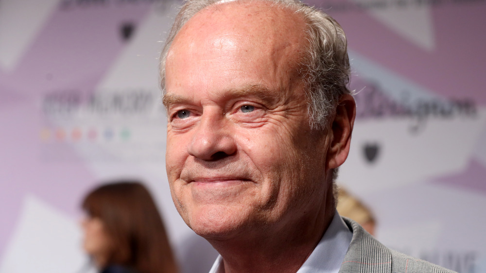 Kelsey Grammer looking off-camera on red carpet