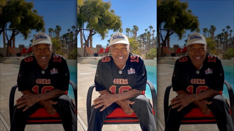 O.J. Simpson smiles in a chair