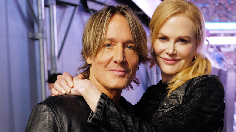 Nicole Kidman and Keith Urban, posing in an arena