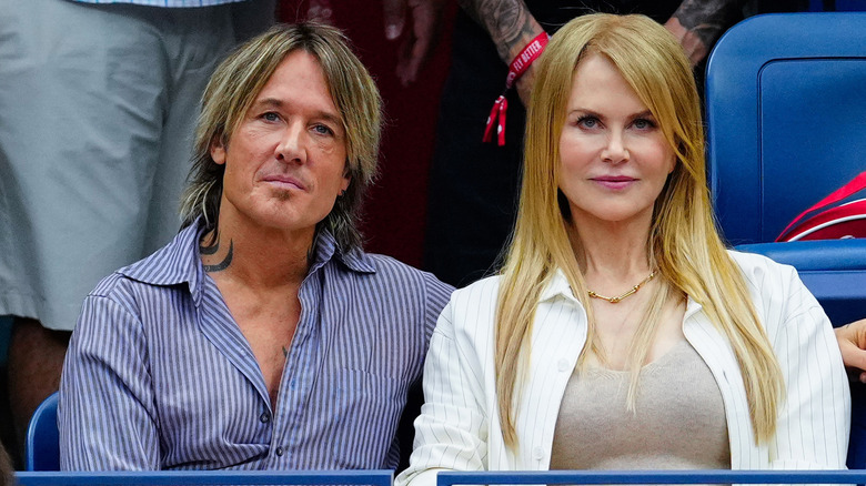 Nicole Kidman and Keith Urban, sitting in the stands