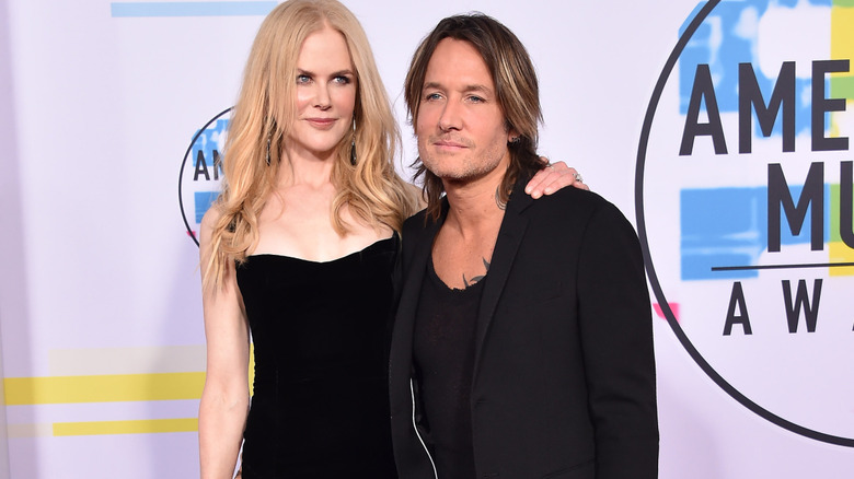 Keith Urban, posing with Nicole Kidman at a music event