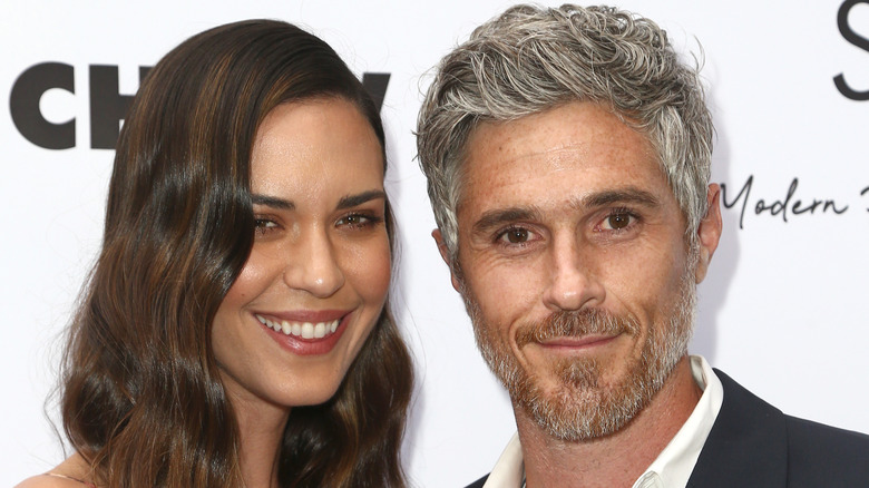 Odette Annable posing with her husband Dave Annable