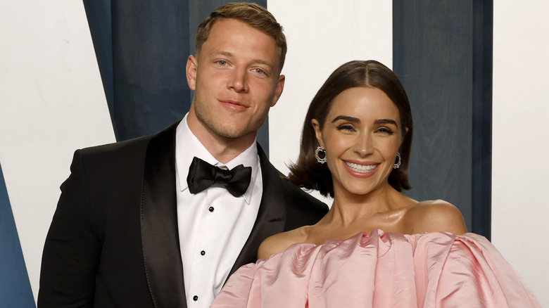 Olivia Culpo and Christian McCaffrey posing