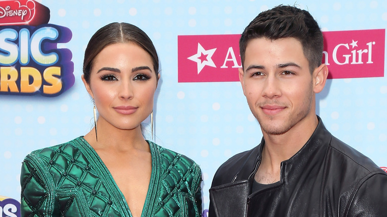 Olivia Culpo and Nick Jonas on a red carpet