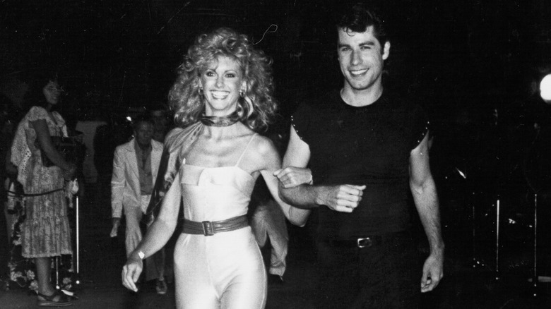 olivia newton-john and john travolta in black and white photo