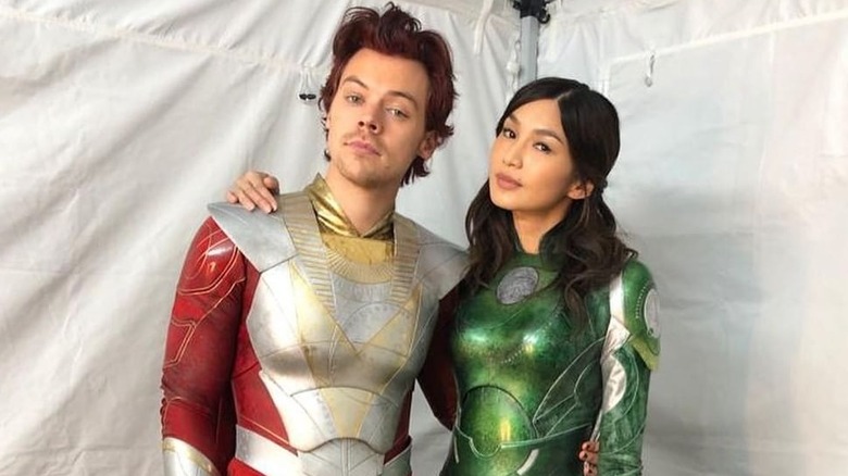 Harry Styles and Gemma Chan together in Eternals costumes