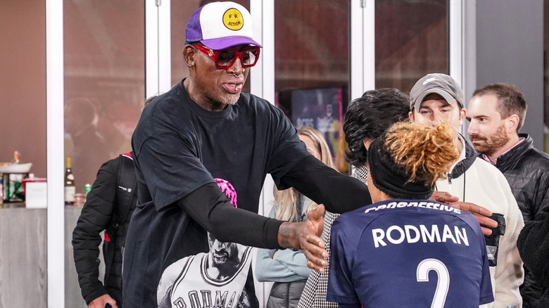 Dennis Rodman hugging Trinity Rodman