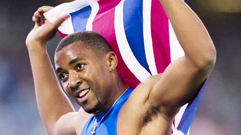 Darren Campbell with a flag