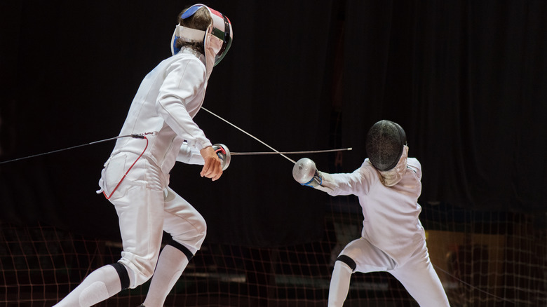 Two men fencing