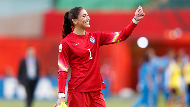 Hope Solo on the field, grinning