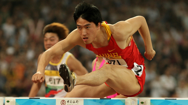 Liu Xiang jumping a hurdle