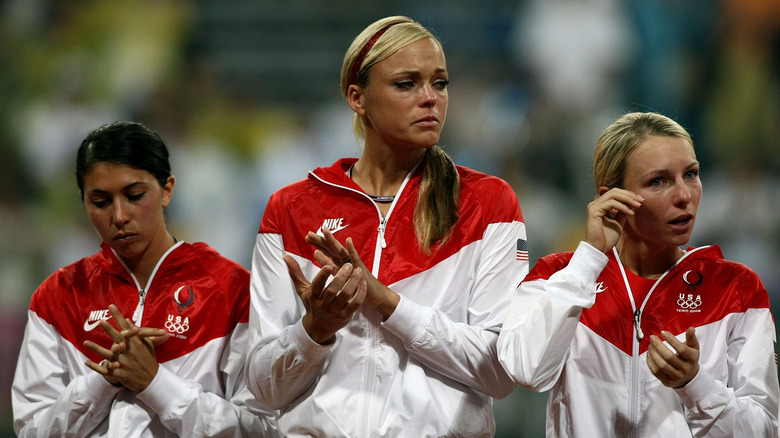 Andrea Duran, Jennie Finch, and Caitlin Lowe in tears