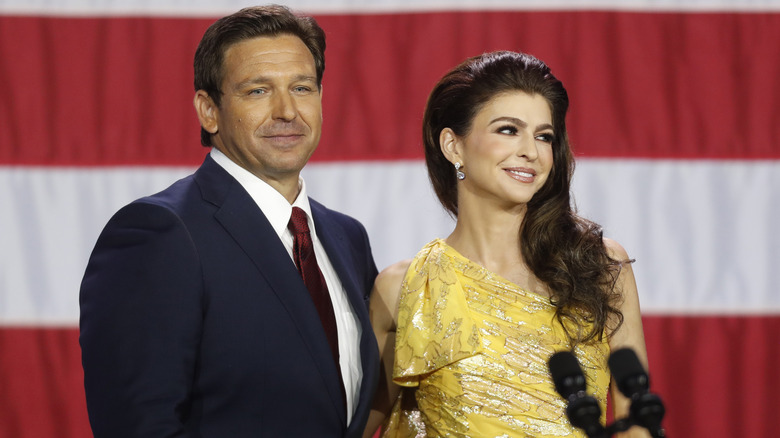 Ron DeSantis and wife Casey DeSantis in front of U.S. flag