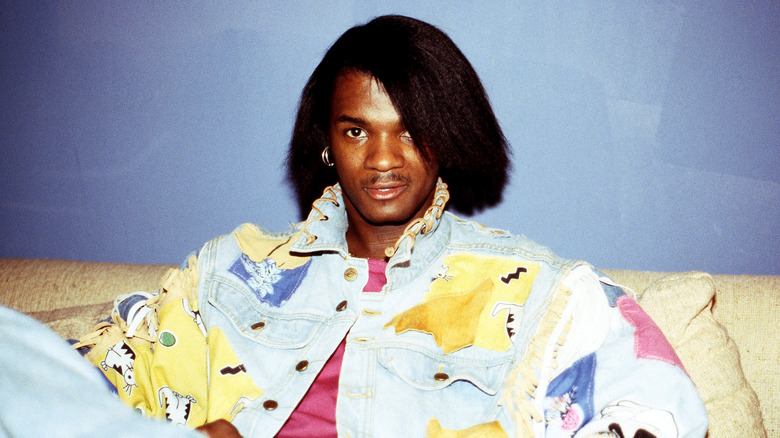 Jermaine Stewart sitting on sofa