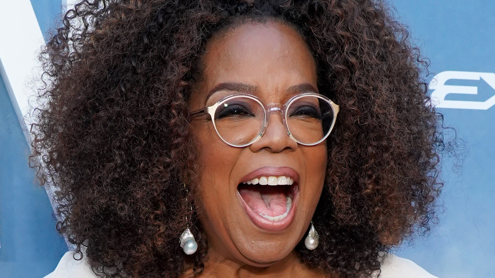 Oprah Winfrey smiling with glasses