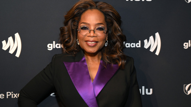 Oprah Winfrey wearing black and purple