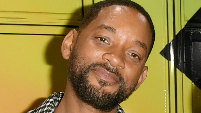 Will Smith smiling with head cocked