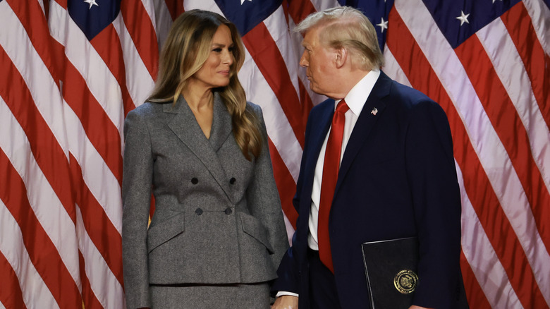 Melania Trump standing alongside her husband as he celebrates his re-election.