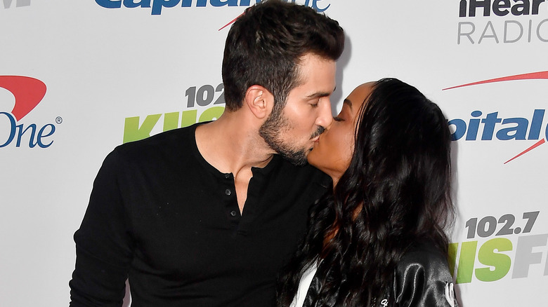 Bryan Abasolo and Rachel Lindsay kiss at an event 