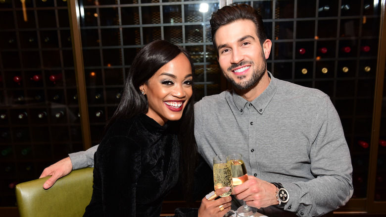 Rachel Lindsay and Bryan Abasolo cheers their champagne glasses