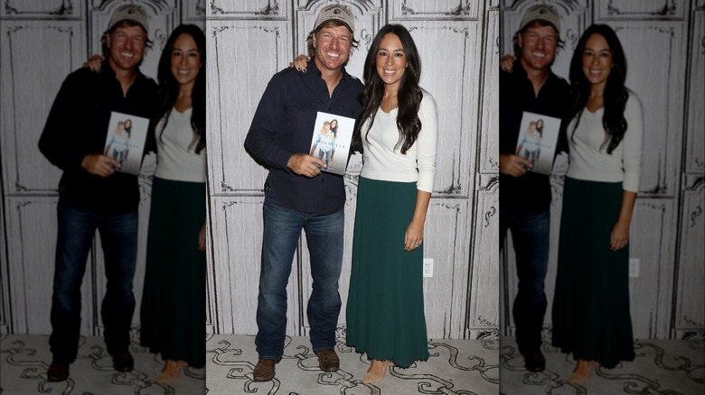 Joanna Gaines with arm around Chip Gaines