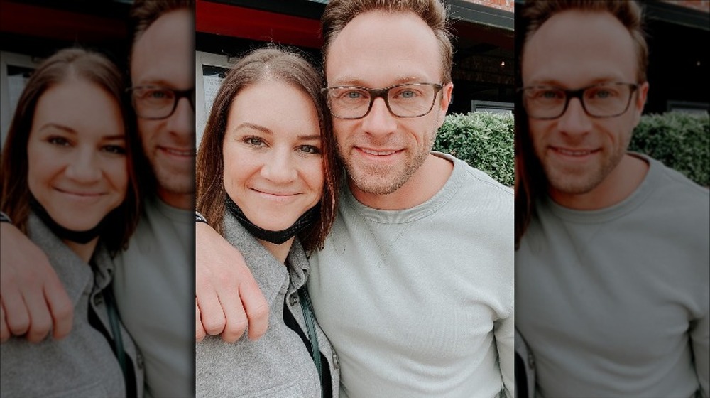 Danielle and Adam Busby smile for a selfie