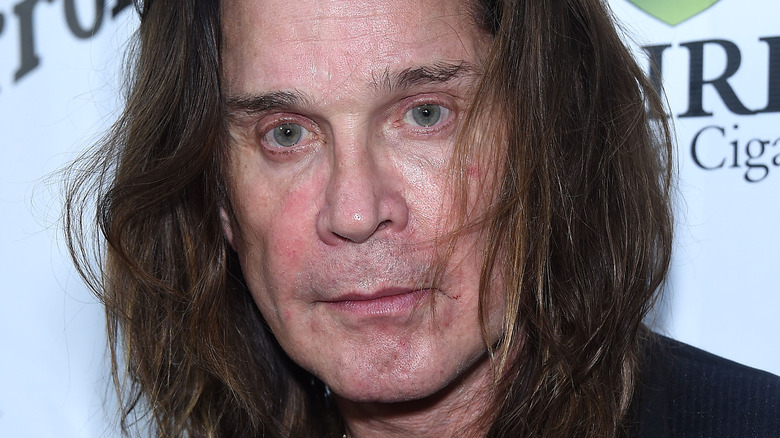 Ozzy Osbourne looking sad long hair