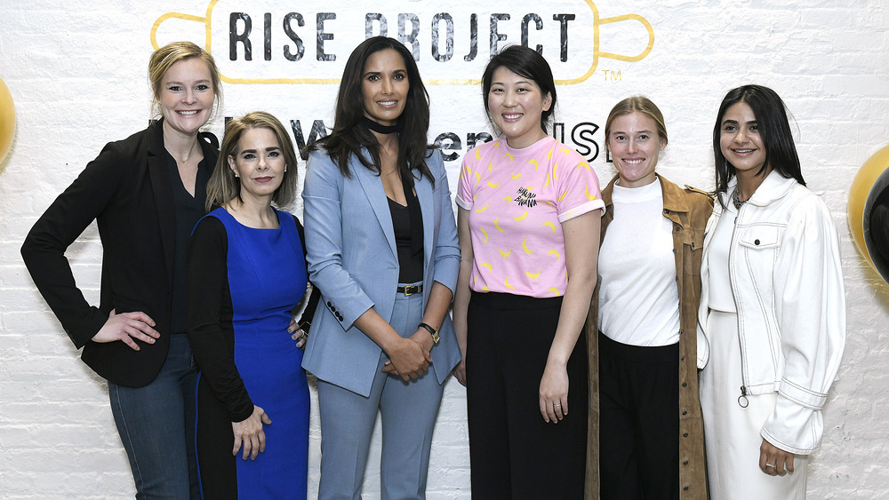 Padma Lakshmi posing with young women 