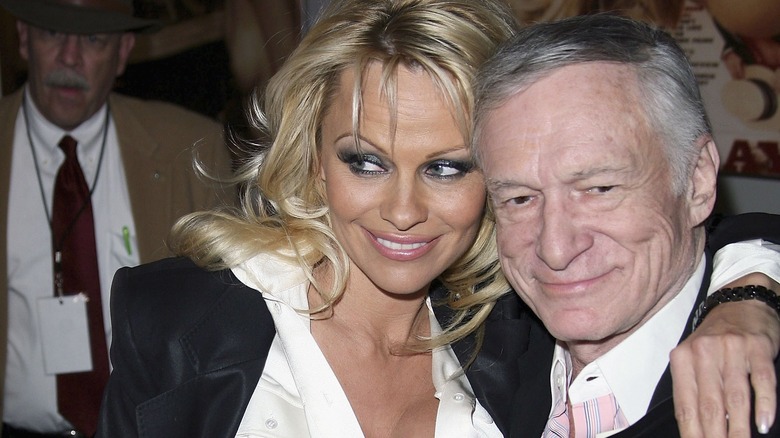 Pamela Anderson and Hugh Hefner smiling