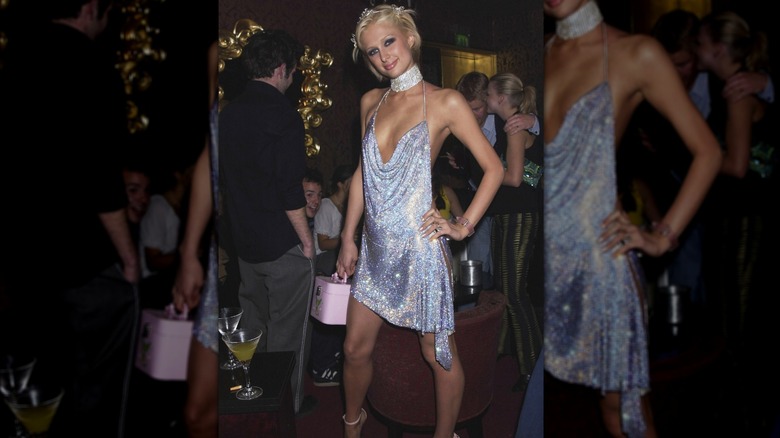 Paris Hilton posing in silver chainmail dress