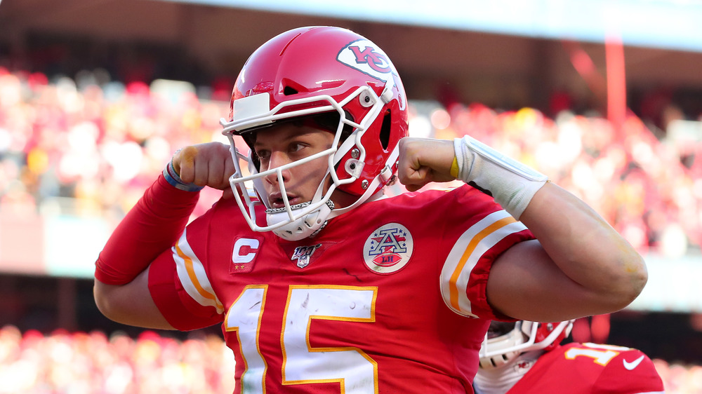 Patrick Mahomes posing on the football field