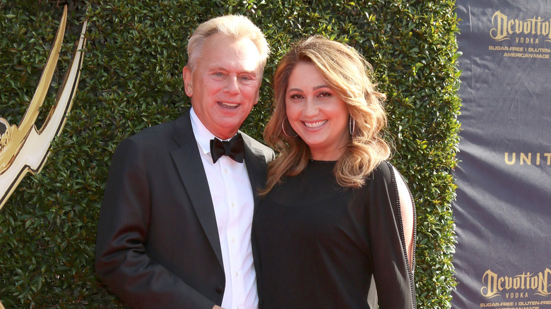 Pat Sajak and Lesly Brown smile together