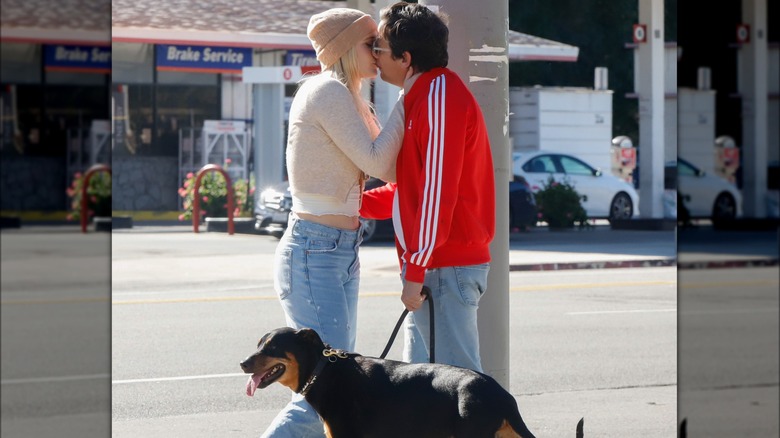 Maggie Sajak and Ross McCall kissing 