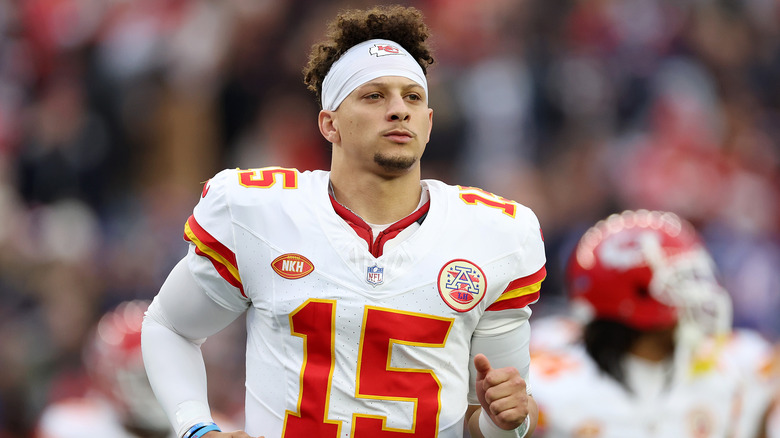 Patrick Mahomes on football field in Chiefs uniform 