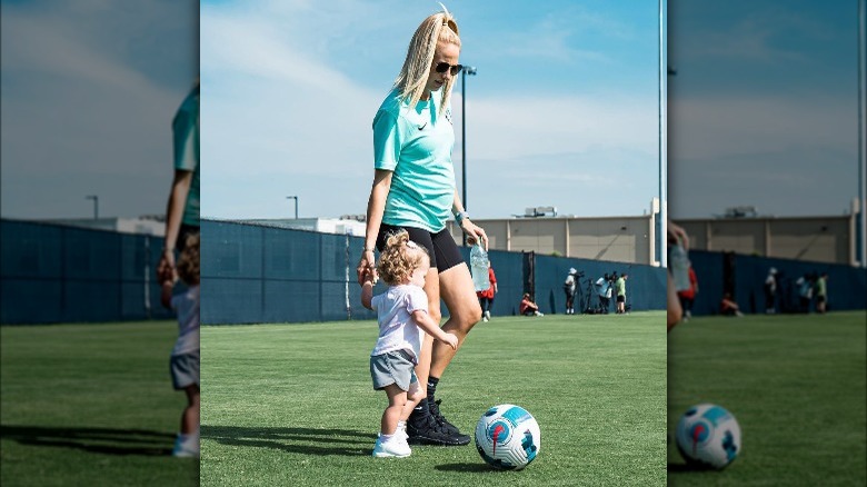 Brittany Mahomes playing soccer with her daughter