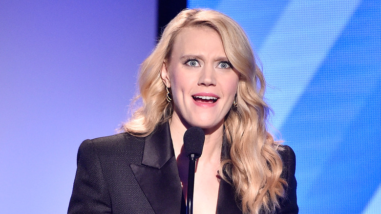 Kate McKinnon in front of microphone