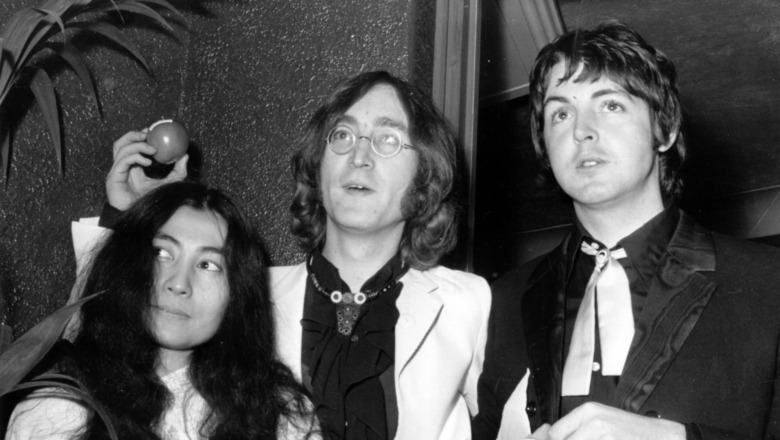 Yoko Ono, John Lennon, and Paul McCartney pose for a picture